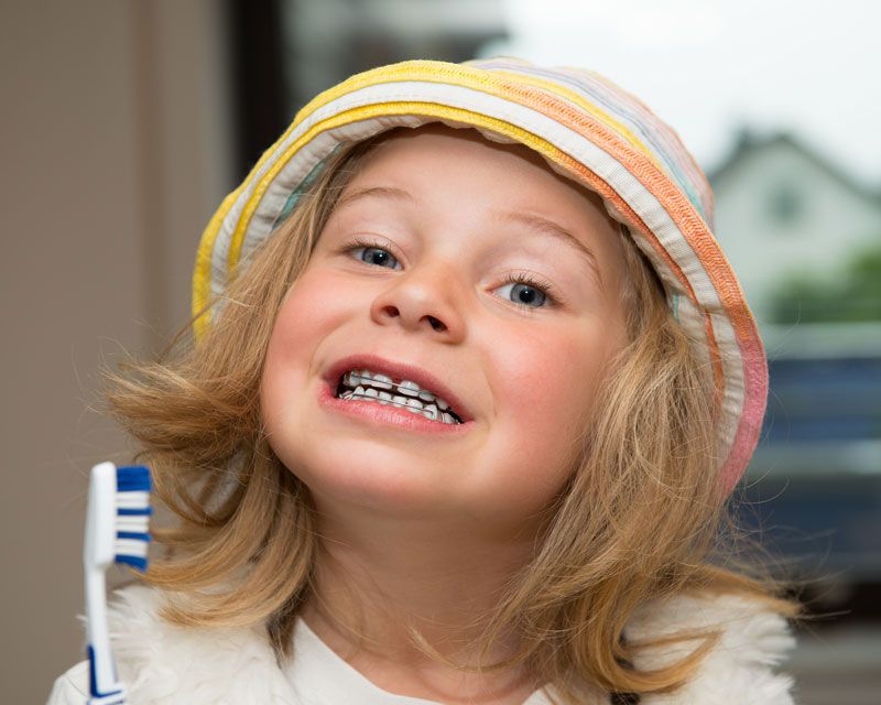 A child that has received kid’s orthodontist treatment in Lakewood, CO