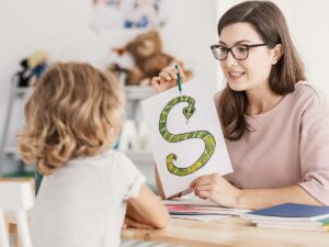A young child in speech therapy